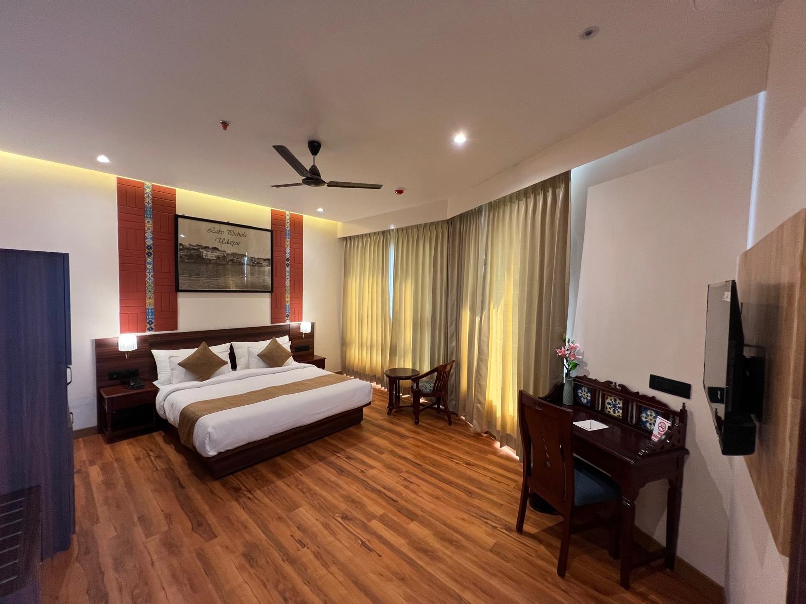 Premium Room bed and interior at Le Prestige Hotel